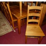 A contemporary light oak dining suite comprising; rectangular dining table on square slightly