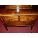 An early 20th century oak low dressing chest of two short over single long drawer, w.91cm