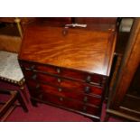 A 19th century mahogany slopefront four drawer writing bureau, having a fitted interior, width 92cm