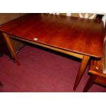 A 1960s teak round cornered extending dining table, having pull-out action and single fold-out leaf,