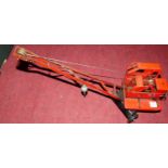 A Triang KL44 Jones tinplate construction crane finished in red and black, loose example, in full