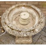 A reconstituted stone circular squat pedestal garden planter, on square base, h.64cm, dia.56cm