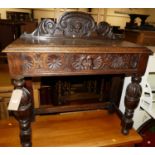 A circa 1900 carved oak ledgeback single drawer hall table, on bulbous forelegs, w.90.5cm