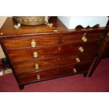 A Regency mahogany and cross banded chest of two short over three long graduated drawers, on splayed