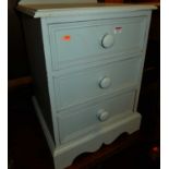 A modern blue painted pine ledgeback three drawer bedside chest, width 46cm