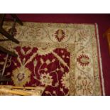 A large hand made Pakistani Farhan 100% new wool rug, 360 x 277 cm (with some wear and losses to