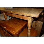 A Victorian pine round cornered small farmhouse kitchen table, having single end drawer and raised