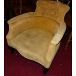 An Edwardian mustard buttoned upholstered tub armchair, width 66cm