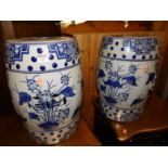 A pair of contemporary Chinese style blue and white decorated stoneware garden barrel seats, each of