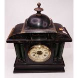 An early 20th century ebonised eight-day mantel clock, of architectural form, the dial showing Roman