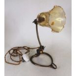 Possibly W.A.S Benson - a lacquered brass desk lamp, having a later tinted glass shade, of