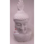 A 20th century white glazed pottery head and shoulders bust of Buddha, h.42cm