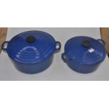 Two Le Creuset blue enamelled cast iron casserole dishes, largest 30cm diameter