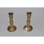 A pair of 19th century turned brass candlesticks, h.20cm