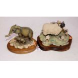 A Border Fine Arts resin model of an African elephant and calf, on mahogany plinth, h.12cm; together