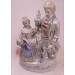 A 20th century Dresden porcelain lustre figure group of a courting couple in 18th century dress, h.