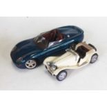 A collection of five diecast scale model sports cars to include Jaguar S-type