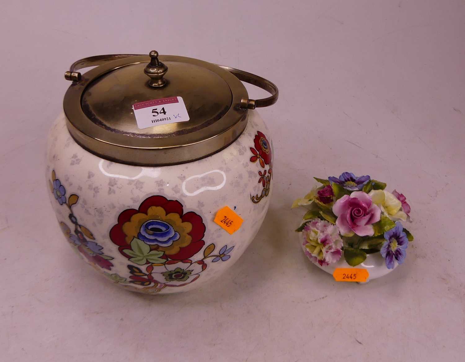 A 20th century porcelain biscuit barrel, h.17cm; together with a Royal Adderley floral encrusted