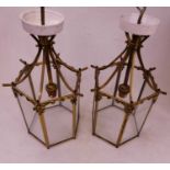 A pair of 20th century brass and glass ceiling pendants, each of hexagonal form with applied