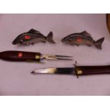 A 20th century Eastern carved knife and fork set, in the form of a fish, length 43cm; together