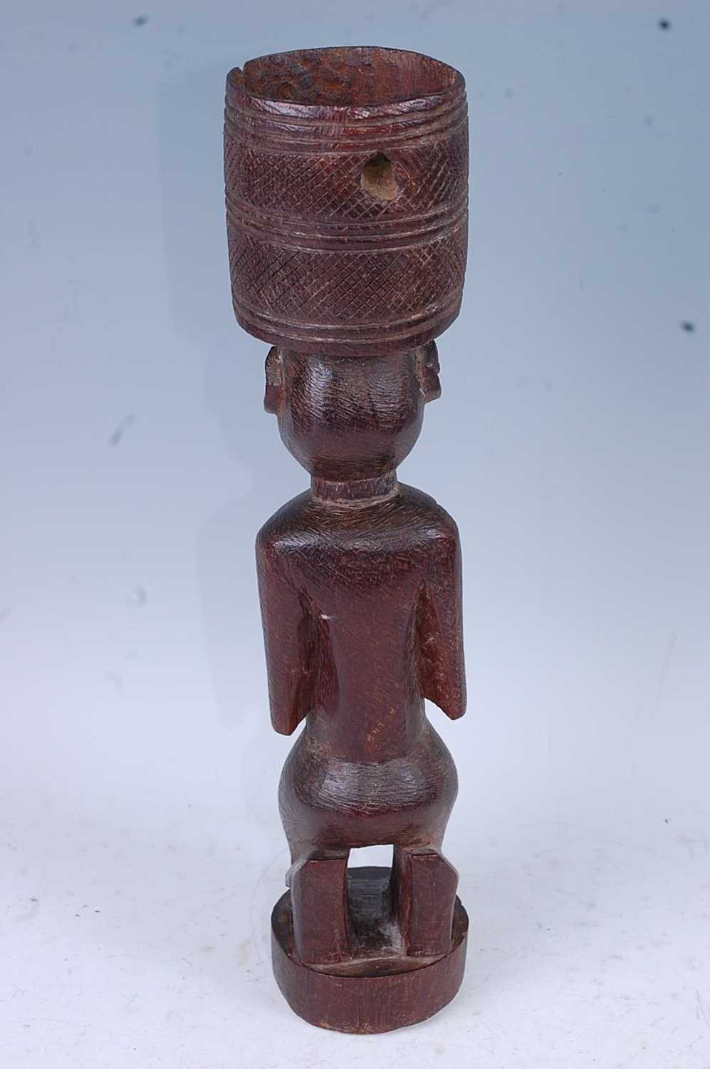 A Bateba Phuwe, carved in kneeling pose with arms upon the chest and an offerings? bowl to the top - Image 3 of 4