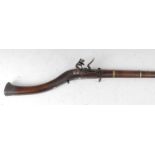 * A 19th century Afghan flintlock jezail musket, the 94cm octagonal barrel with white and yellow