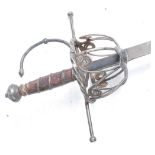* A Continental rapier in the 17th century style, having an 88cm fullered blade with wrought iron