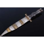 An African dagger, having a 17cm Bowie type blade etched to the ricasso, the shaped ebonised