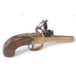 * A 19th century box-lock flintlock pocket pistol, having a 5cm turn-off brass barrel, the brass