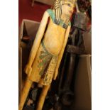 An Egyptian Revival polychrome painted figure of a standing Pharoah, further tribal carved