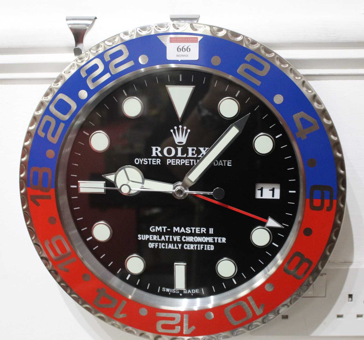 A Rolex style Pepsi dial wall clock, with quartz movement, dia.34cm