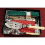 A box of miscellaneous silver plated and steel flatware, to include silver plated fish servers,