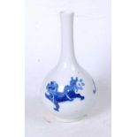 A Chinese export blue and white glazed bottle vase, decorated with three shishi, apocryphal double