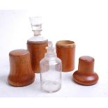 A 19th century treen apothecary jar and cover, the screw cap opening to reveal a glass jar, the