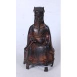 A Chinese cast metal figure of a seated nobleman, shown with hand raised, six character mark