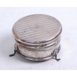 A George V silver trinket box, of circular form, having hinged lid with engine turned decoration,