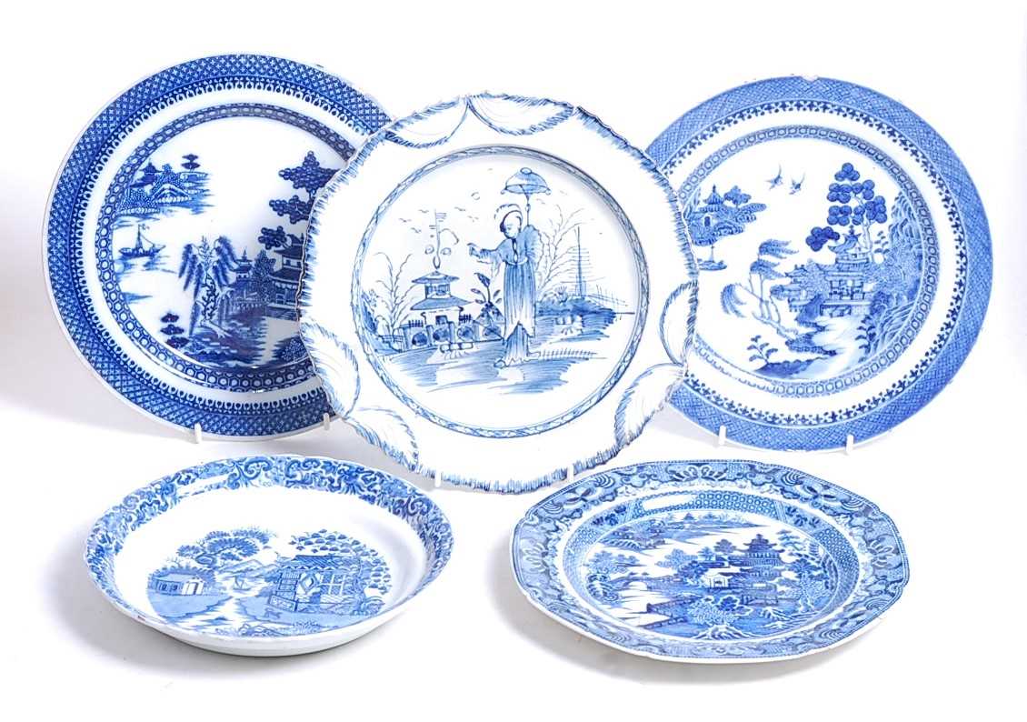 An 18th century blue and white pearlware plate, decorated in cobalt blue with a Chinese figure