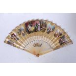 An early 20th century lady's fan, having faux mother of pearl sticks, the paper fan decorated with