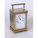 An early 20th century French lacquered brass cased carriage clock, with single train movement and