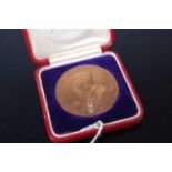 A George V 1911 bronze Coronation medal in fitted leather case
