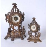 A reproduction pressed brass mantel clock, having a circular dial with Roman numerals, surmounted by