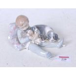 A Lladro Spanish porcelain figure group of a boy with his dogsCondition report: No apparent faults.