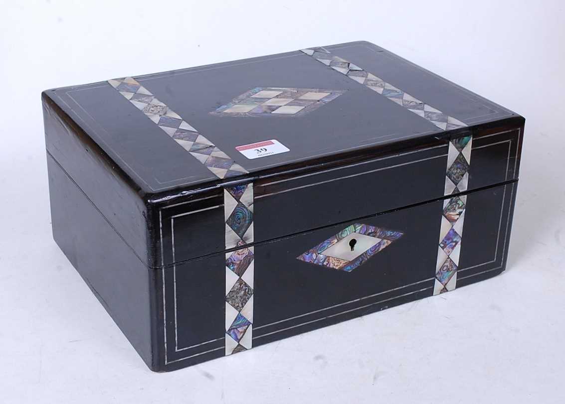 A Victorian ebonised mother of pearl and paua shell inlaid lady's work box, the hinged lid opening