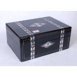 A Victorian ebonised mother of pearl and paua shell inlaid lady's work box, the hinged lid opening