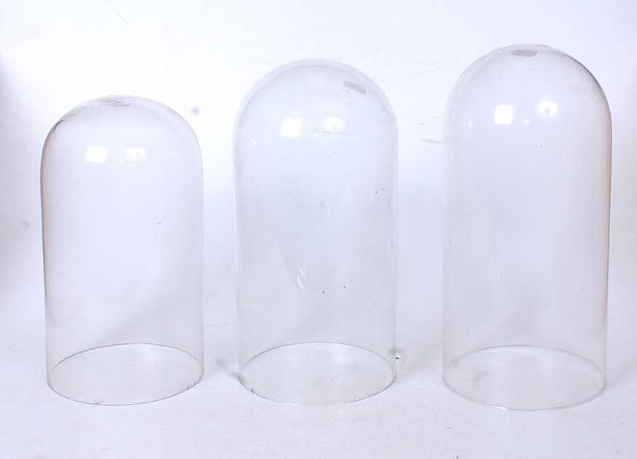 Three 20th century glass clock domes, height of largest 30.5cmCondition report: One of the larger