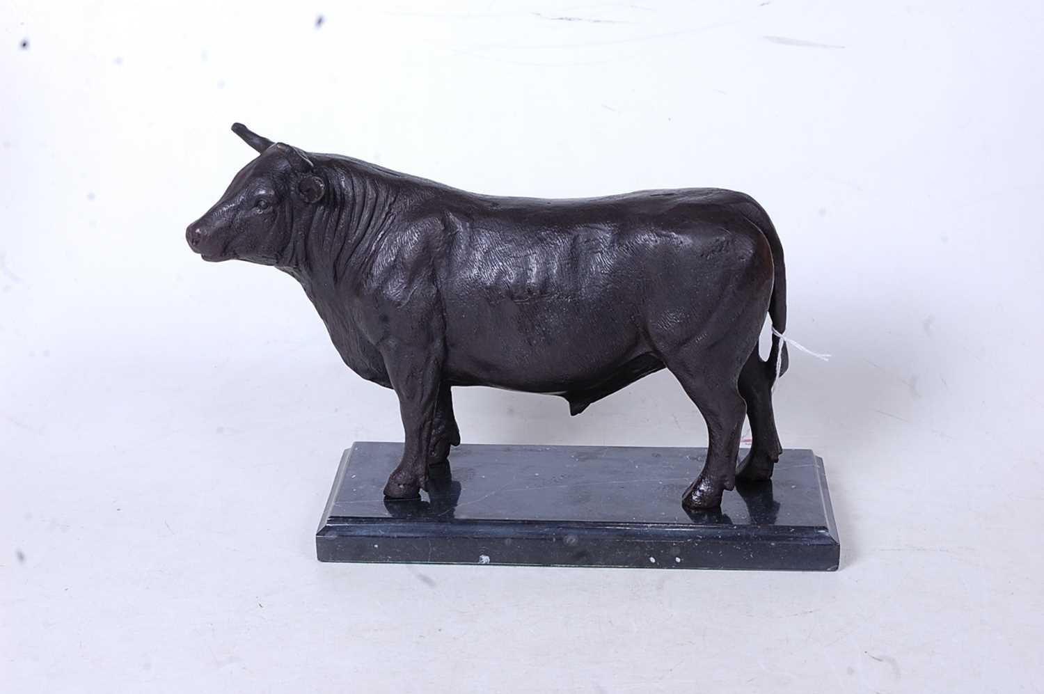 A bronze model of a bull in standing pose on marble plinth, height 19cm - Image 2 of 3