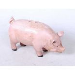 A reproduction cast metal money-box in the form of a pig