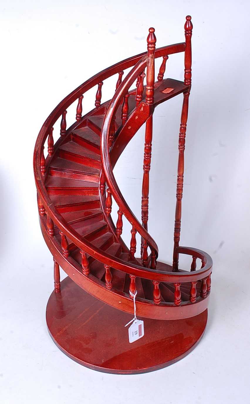 A modern stained ply model of a spiral staircase, h.60cm