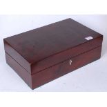 A Victorian mahogany writing slope of plain rectangular form, the hinged lid opening to reveal