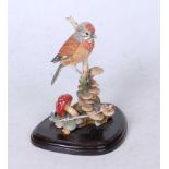 A Country Artists resin model of a bird upon a stump, h.14cm, boxed